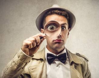 guy looking through magnifier